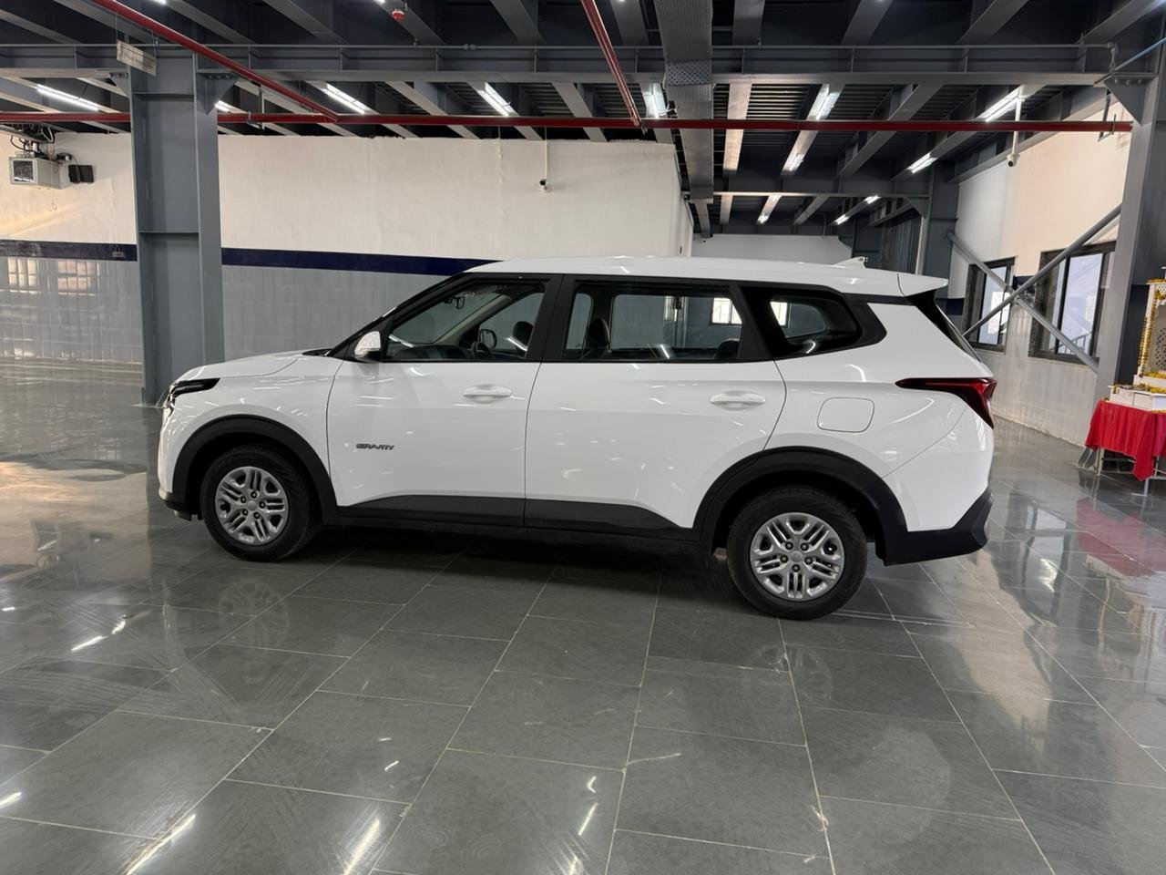 
								“Caren G1.5 6MT in Gravity White – Now at AM KIA Jammu!” full									