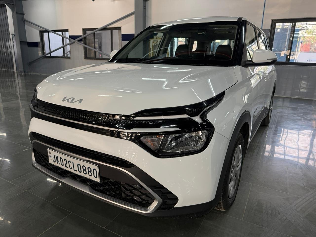 
								“Caren G1.5 6MT in Gravity White – Now at AM KIA Jammu!” full									